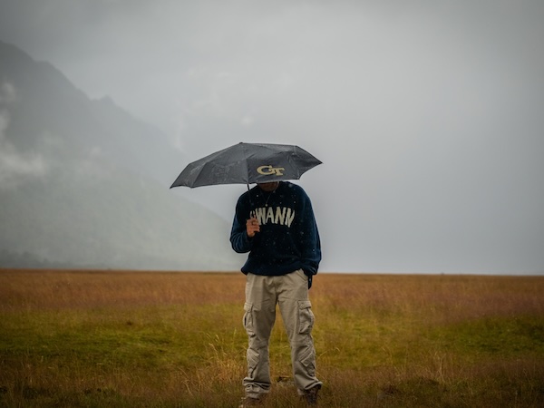 Student in the rain.